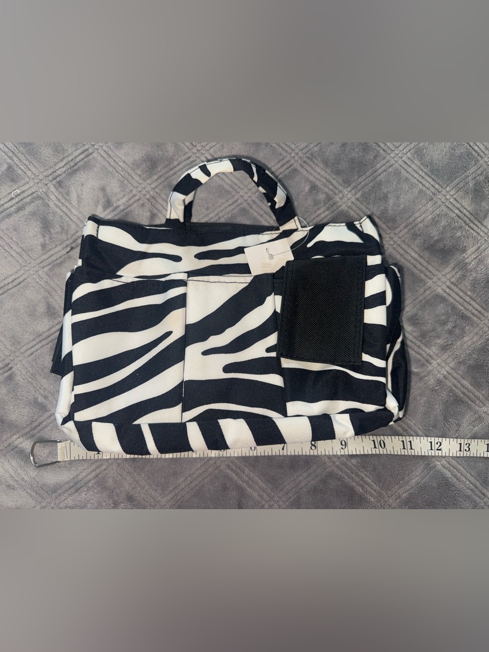 Zebra print organizer bag with handle and pockets